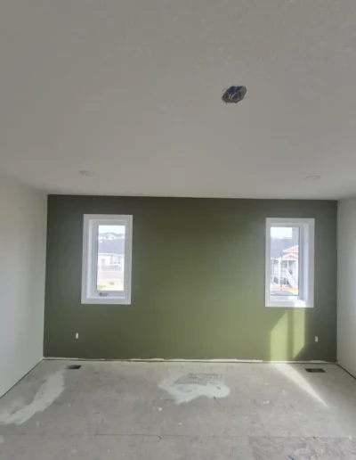 Green colored wall with window both side